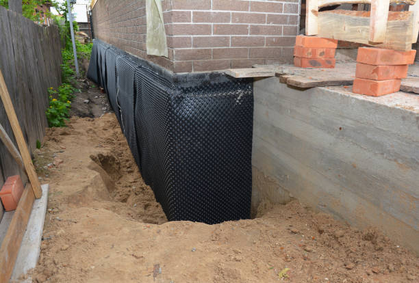 Happy homeowners after waterproofing job in Scottville